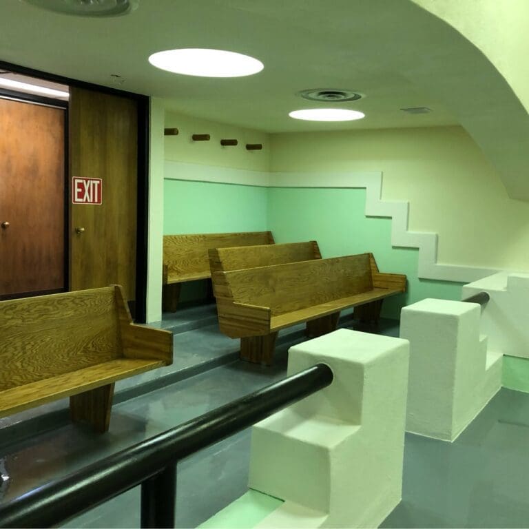 Completed interior refurbishment of the Hopi Courthouse seating area, featuring newly finished epoxy flooring, restored timber benches, and upgraded wall and ceiling finishes