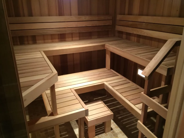 Cedar-lined sauna interior with multi-level wooden benches